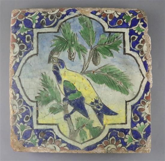 A large Persian parrot tile, Qajar dynasty, 29.5cm sq., glaze losses to edge